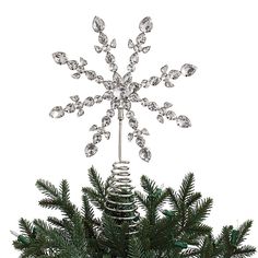 a christmas tree is decorated with crystal ornaments