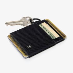 Our patented Elastic Wallet is the original Thread® wallet. The perfect minimal way to hold all your cards, durable enough for all of life’s adventures. The signature elastic fits tightly on your cards and cash, keeping them secure no matter where you take them. Details Holds 2-8 cards/cash Durable tight knit elastic Built in keyring to attach keys, lanyard, etc. Elastic contains latex Length: 2.75 in (7 cm) Width: 2.2 in (5.5 cm) Thread Wallets, Swim Fins, Book Bar, Keychain Clip, Wrist Lanyard, Surf Accessories, Resin Uses, Mat Bag, Beach Gear