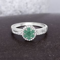 Emerald Ring, Natural Emerald Floral Silver Ring for Women, May Birthstone, Emerald Jewelry, Emerald Gifts for Mom, Bridesmaid Gift for Her Flaunt yourself with this emerald & white topaz halo ring. The natural gemstones have a combined weight of 0.58 carats and are set in .925 sterling silver with rhodium plating. The green hue of this ring adds a pop of color to any look! The understated design and vibrant stones makes this ring perfect for every occasion. ♥ Benefits of wearing Emerald gem Silver Emerald Ring, Jewelry Emerald, Blue Topaz Jewelry, Silver Ring For Women, Aquamarine Jewelry, May Birthstone, Beautiful Engagement Rings, 18k Gold Jewelry, Emerald Engagement Ring