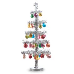 a silver christmas tree with multicolored ornaments