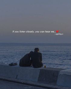 two people sitting on the edge of a pier looking out at the ocean with a quote above them