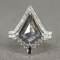 a fancy ring with an unusual shaped diamond in the center