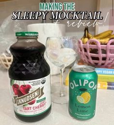 two bottles of juice and a glass on a counter top with the words making the sleepy mock cocktail review