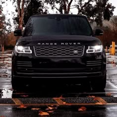 a range rover is parked in the rain