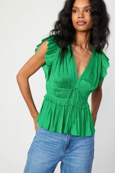 Add depth and dimension to your outfits with this plunging V-neck top. Accented by fluttery cap sleeves, the micropleated bodice features tie detailing and a comfortable cinched waist before flaring out to a ruffled peplum. •V-neckline •Pleated cap sleeves •Tie detail at front •Elasticized waist •Ruffled peplum Item number 2430072 50%RECYCLE POLY 50%POLY Gentle Cycle Cold Peplum Fabric, Deep Spring, Print Trends, Sweater Gift, Vacation Dresses, Spring Green, Sweater Sale, Trending Dresses, Sweater Blouse