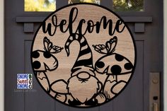 a welcome sign on the front door of a house that has been decorated with cartoon characters