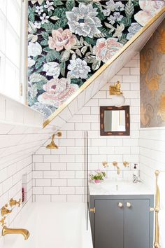 the bathroom is decorated in gold and white