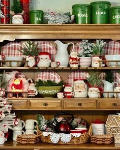 a shelf filled with lots of christmas decorations