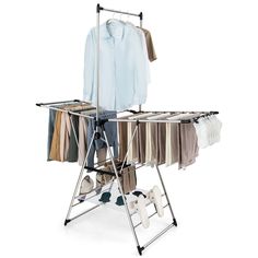 an ironing board with clothes hanging on it