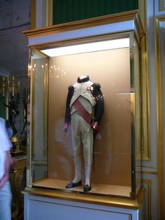 a display case with a uniform on it