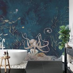 a bathroom with an octopus mural on the wall next to a bathtub and sink