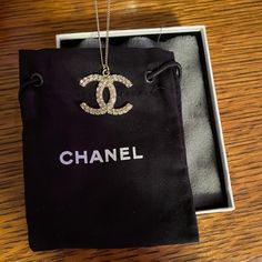 Chanel Logo Necklace. Never Worn. Received As A Gift Years Ago And Never Wore. Stored In Original Box & Dust Bag. Chain Is 18" Long I Believe. Front Has Stones All Along The C's. Very Pretty, Just Wasn't My Style. Elegant Round Necklaces With Gift Box, Elegant Round Necklace With Gift Box, Luxury Diamond Pendant Necklace For Party, Designer Pendant Jewelry For Formal Occasions, Elegant Diamond Necklace Vs Clarity As Gift, Luxury Jewelry With Gift Box, Elegant Jewelry With Gift Box, Elegant Round Jewelry With Gift Box, Luxury Silver Necklace For Evening