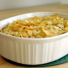 a casserole dish filled with oatmeal on top of a wooden table