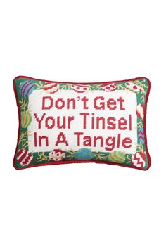 a cross stitch pillow that says, don't get your tinsel in a tangle