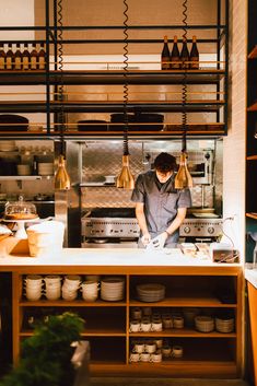 a man is preparing food in a kitchen