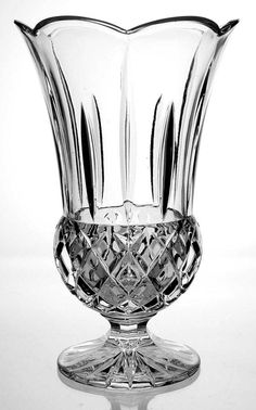 a clear glass vase sitting on top of a table