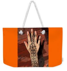 a woman's hand with hennap on it weekend bag