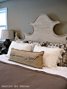 a bed with two pillows on top of it and a pillow that says berne graft