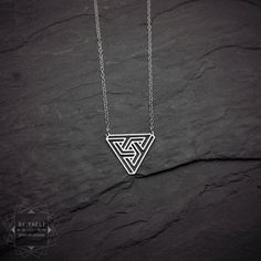 Geometric necklace – This stylish inverted triangle pendant features an Escher-inspired cutout design, almost like a maze. ★ Comes in our signature gift box, ready for gift giving. ★ Available in Silver [Sterling silver chain & silver plated pendant] ★ Pendant size : 1"x1.20" . Thanks for shopping at ByYaeli♥ All images, texts & products ... Jewelry Design Studio, Chevron Necklace, Inverted Triangle, Triangle Necklace, Triangle Pendant, Cutout Design, Geometric Necklace, Unique Jewelry Designs, Geometric Jewelry