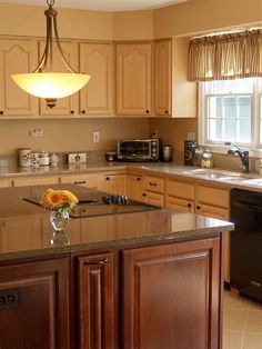 a large kitchen with an island in the middle