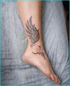 a woman's foot with a tattoo on it and an angel wing above the toe