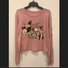 New With Tags Love Tribe Looney Tunes Long Sleeve Graphic Tee In Mauve, Size Xl. Bugs Bunny, Lola Bunny, Daffy Duck, Sylvester And Tweety Bird Let Their Personalities Shine Through On This Tee. Headshot Graphics Of The Characters On The Left Sleeve Too! Graphics Are Intentionally Distressed. Boxy, Slightly Cropped Silhouette And Soft Fabric. 60% Cotton, 40% Polyester. Machine Wash Cold. Fall Cartoon Print Tops For Loungewear, Cute Graphic Print Tops For Loungewear, Casual Tops With Cartoon Print For Loungewear, Cute Tops With Cartoon Print For Loungewear, Cute Cartoon Print Tops For Loungewear, Bugs Bunny Lola, Sylvester And Tweety, Lola Bunny, Long Sleeve Graphic Tee