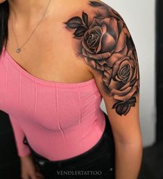 a woman with a rose tattoo on her shoulder