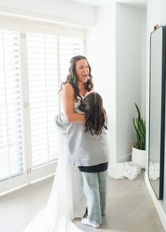 There’s nothing like a warm hug from a loved one before saying “I do.” This candid moment perfectly captures the happiness and excitement of the big day!