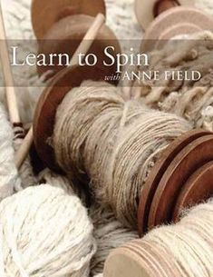 yarn and wooden spools with text learn to spin with annie field knitting supplies