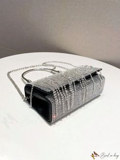 BirdinBag - Rhinestone Evening Clutch: Luxury Box-Shaped Handbag with Tassel Accents Evening Crystal Bag In Rectangular Shape, Crystal Evening Bag, Rectangular Shape, Evening Crystal Rectangular Bag, Rectangular Crystal Evening Bag, Luxury Party Bags With Rhinestone Fringe, Rectangular Clutch With Rhinestones, Silver Bag With Rhinestone Fringe For Events, Silver Bags With Rhinestone Fringe For Events, Rectangular Crystal Bag With Bling