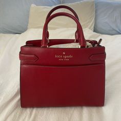 Kate Spade Staci Bag In Medium Size. Beautiful Dark Red Color, Brand New With Tags. It’s The Perfect Size For Everyday Use! Not Too Big, But With A Decent Capacity. This Bag Has Been Discontinued, So You Won’t Find It New Anywhere Else! Original Retail For $399. Medium Bags Handbags, Dark Red Handbag, Elegant Red Rectangular Bag, High-end Red Shopping Bag, Elegant Red Shoulder Bag With Detachable Handle, High-end Red Bag For Everyday Use, Elegant Red Rectangular Satchel, Classic Red Handheld Satchel, Classic Red Shopping Bag