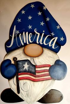 a wooden sign that says america with a clown face and an american flag hat