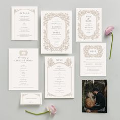 the wedding stationery is laid out on a table