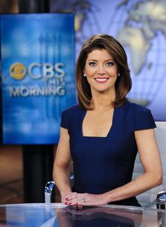 a woman sitting at a desk in front of a news set with the abcs morning show logo on it