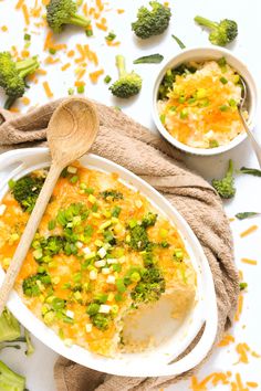 broccoli and cheese casserole in a bowl with a wooden spoon