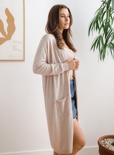 Beige Soft Knit Sweater Coat For Loungewear, Lightweight Long Sleeve Winter Cardigan, Spring Loungewear Cardigan With Soft Texture, Cozy Long Sweater Coat For Daywear, Lightweight Casual Cardigan In Solid Color, Versatile Soft Knit Cardigan For Loungewear, Lightweight Winter Cardigan For Layering, Soft Casual Outerwear For Loungewear, Casual Lightweight Cardigan