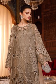 Chiffon Brown Salwar Kameez Pakistani Party Dresses come in a Tissue and chiffon combined shirt with intricate hand work and zardozi motifs paired with cotton salwar, which is simple and plain. Pakistani Party Dress Kameez: The traditional dress has a very stylish and elegant neckline emblazoned with moti and threadwork. This party attire is embellished with floral designs on Silk Tissue and adorned with pearls, dabka, naqshi, and gleaming stones. Salwar: Pakistani Party Dresses come in a tradit Nikkah Dress, Winter Formal Dresses, Gaun Fashion, Kids Frocks Design, Pakistani Style, Desi Outfits, Maria B, Desi Clothes, Kids Frocks