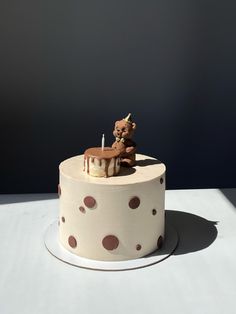 there is a cake with a teddy bear on it