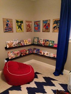 a child's room with comic books on the shelves and a bean bag chair