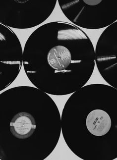 black and white photograph of records stacked on top of each other