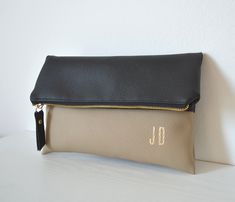 "Personalized Clutch Bag, Colorblock Imprinted Clutch Purse, Bridesmaid gift, Foldover Clutch Bag, Black / Taupe Clutch This bag is handcrafted from high-quality faux leather and custom personalized with the initials. The interior is fully lined with cotton fabric and has an inside pocket. The initials are printed in gold-tone on the bottom right corner. This bag can be a perfect gift for someone or for yourself. The bag size is 11\" x 7\" when folded. Feel free to contact me about any custom or Personalized Clutch, Wedding Bags, Foldover Clutch, Handmade Clutch, Wedding Bag, Pretty Bags, Bags Purses, Bridesmaid Gift, Clutch Purse