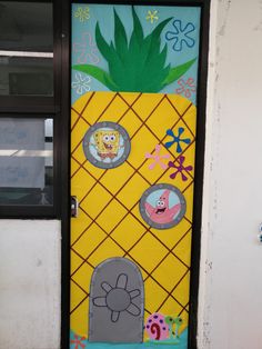 a door decorated with pineapples and other cartoon character stickers on the side