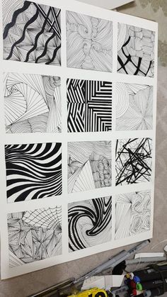 some black and white drawings on a wall