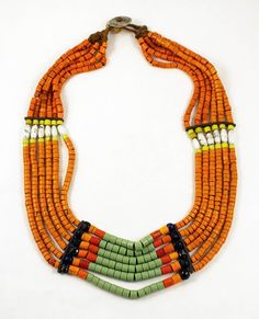 Naga necklace made of six rows of  glass  beads, with bone spacers.  From mid 20th Century. Length of smaller row: 73 cm Length of longer row (approx.): 86 cm Weight: 301,7 gram Bibliography: Jacobs, Julian "The Nagas - Hill Peoples of Northeast India" Leurquin, Anne "Colliers ethniques" Daalder, Truus "Ethnic Jewellery and Adornments" IND1677 If sold outside of the EU, the buyer is responsible for paying import duties. Shipping: items purchased are ready for shipping in maximum 1-2 days, if not Traditional Orange Multi-strand Jewelry, Traditional Fair Trade Beads For Jewelry Making, Traditional Multi-strand Wooden Bead Necklaces, Traditional Multi-strand Polished Beads, Traditional Multi-strand Beaded Necklaces For Festivals, Traditional Multi-strand Polished Beaded Necklaces, Traditional Multi-strand Beads For Festivals, Traditional Orange Wooden Beaded Necklaces, Traditional Multi-strand Beads For Jewelry Making