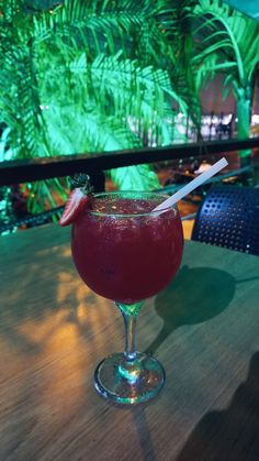 a drink sitting on top of a wooden table