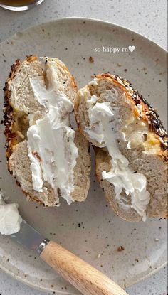 a white plate topped with two pieces of bread covered in whipped cream next to a cup of tea