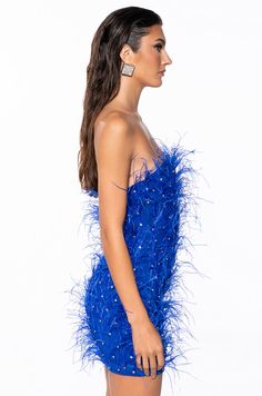 You’re about to ruffle their feathers in The AKIRA Label Primrose Strapless Embellished Feather Mini Dress In Blue! Designed from a stretchy lined mesh base fabrication, this knockout number features opulent, rhinestone-embellished feather body detailing, a strapless neckline, a curve-hugging bodycon fit, polyester inner lining, a mini length silhouette, and a tonal back zipper closure. For a fab finish, style with The AZALEA WANG Just For You Rhinestone Boot in Blue. - Shell: 92% Polyester 8% Spandex, Lining: 95% Polyester 5% Spandex - Stretchy - Imported (all measurements are approximate from size small) - 24” Chest to Hem - Model is 5’9” Product ID: 380835 Feather Mini Dress, Blue Shell, Azalea Wang, Strapless Neckline, Feathers, Mini Dress, Dresses, Blue