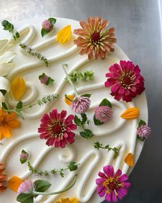 a cake decorated with flowers and icing