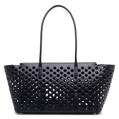 Black leather tote bag from Alaïa. The Neo Mina tote bag is made of perforated leather with an elongated shape, zip closure and long handles for shoulder carry.Measurements: L32 x H19 x W16 cmMade in Italy Chic Shopping Bag With Perforations, Chic Shopping Bags With Perforations, Perforated Tote Bag For Shopping, Luxury Bags With Perforations For Daily Use, Chic Tote Bag With Perforations, Everyday Perforated Tote Shoulder Bag, Perforated Tote Shoulder Bag For Everyday Use, Leather Bags With Perforations For Everyday Use, Leather Bag With Perforations For Daily Use