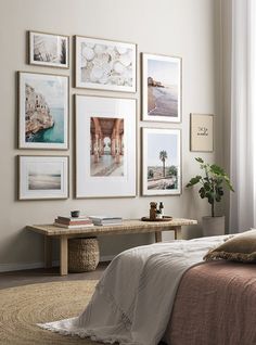 a bedroom with pictures hanging on the wall